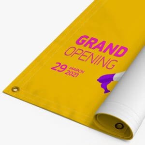 A yellow banner with the words grand opening on it.