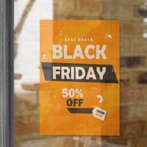 A black friday sign hanging in the window of a store.