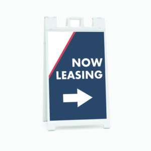 A sign that says now leasing with an arrow pointing to the right.